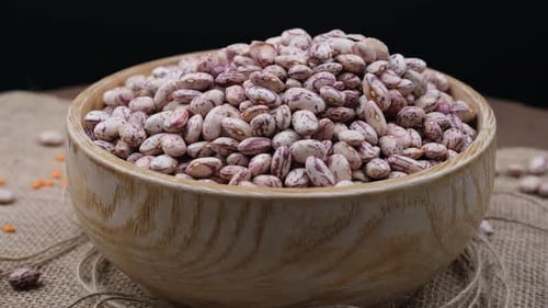 Pinto Beans Overflowing in Wooden Bowl