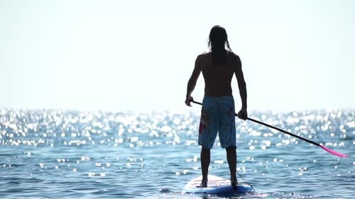 Man Sup Sea Strong Athletic Man Learns to Paddle Sup Standing on Board in Open Sea Ocean on Sunny