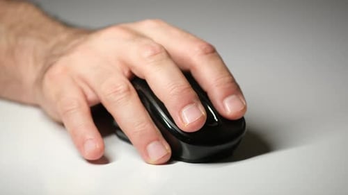 Using Computer Mouse on Clean Grey Background – Close Up Shot