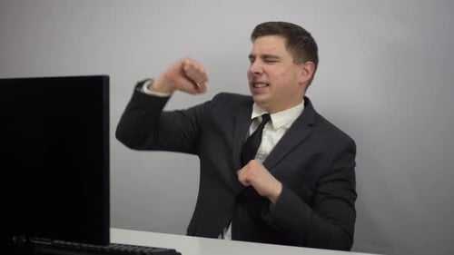 Young Businessman Dancing After Work Done