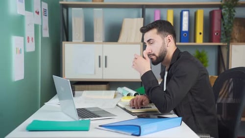Office worker with tired eyes.