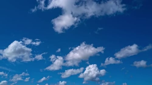 White Clouds Float Across a Blue Sky