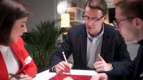 Business People Talking Strategy With Tablet At Office Desk In Creative Team In Office Productive