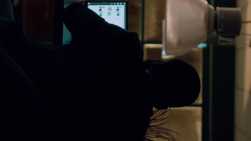 Vertical Video Employee Alone Overnight in Office