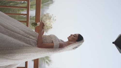 Bride Posing with a Flower Bouquet