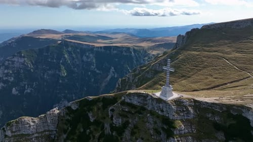 View of the Cross of Heroes on Mount Caraiman in the Bucegi Mountains, Romania