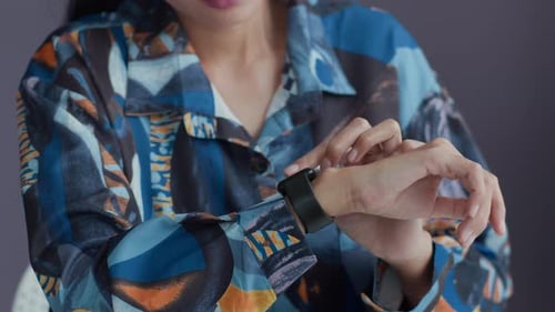 Young Adult Using Smart Watch Technology Close Up