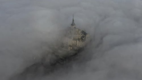 Aerial view of Mont Saint-Michel in fog, France.