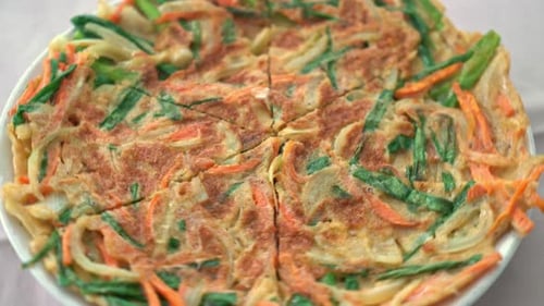 Savory Pancake with Vegetables Cut into Wedges