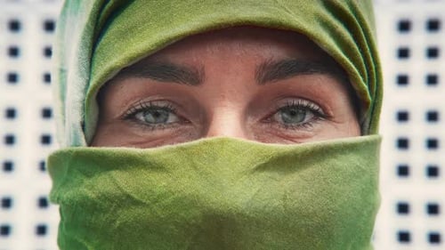 Close Up of Woman with Green Eyes and Headscarf