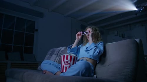 Woman Watches Movie with 3D Glasses at Home