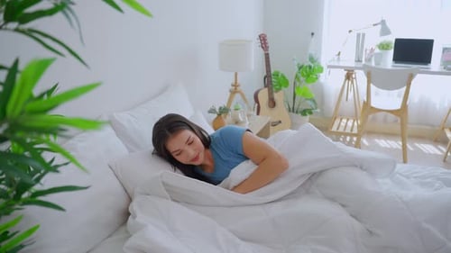 Woman Lying Down and Sleeping in Bed