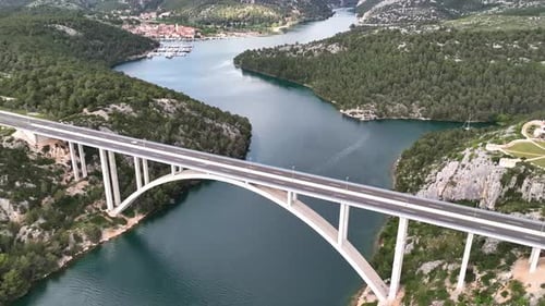 Drone flight above a beautiful arch bridge near the town of Shibenik in Croatia
