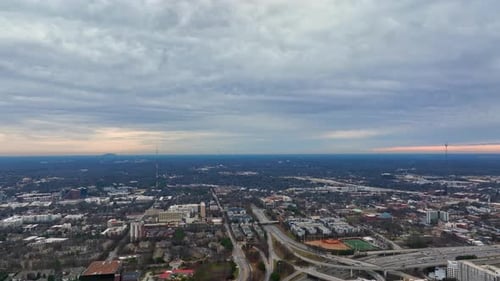 Aerial birds eye view of Atlanta cityscape, Freeway, Georgia under cloudy sky, USA