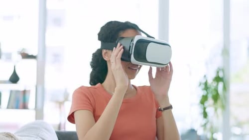 Young Woman Using Virtual Reality Headset in Home