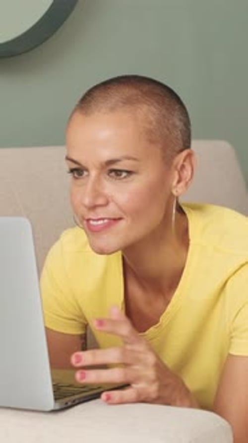 Woman Using Laptop Indoors