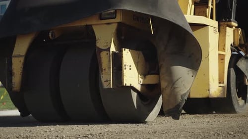 Heavy Road Roller Compacting Asphalt on City Street