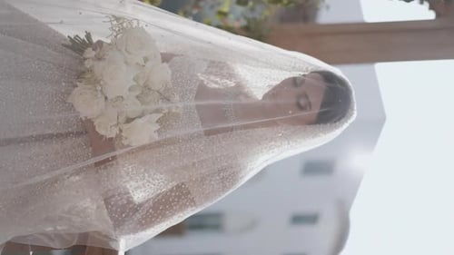 Bride in White Wedding Dress and Veil Outdoors