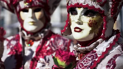 Masked Performers in Ornate Costumes at Carnivale Festival
