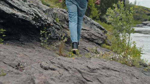 Tourist Climbing Up Hill