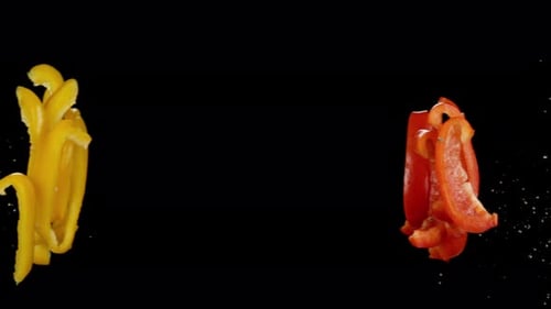 Red and Yellow Bell Pepper Slices Floating