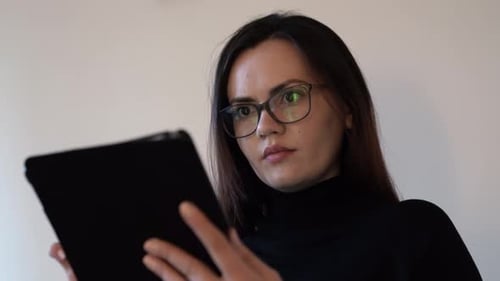 Woman Using Tablet Indoors, Close-Up
