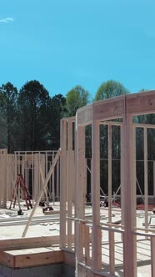 Work in Progress Wooden Framing Beams in an Unfinished House Construction View