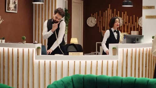 Hotel Employees Working at the Front Desk