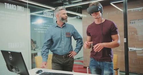 NEW YORK April 5 2017Two Handsome Scientists Testing Virtual Reality Glasses in Science Centre Guy