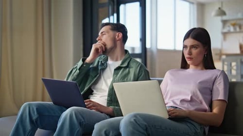 Exhausted Freelancers Working Computers Sitting Couch Closeup Fatigued People