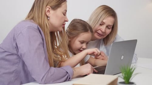 Family Works at the Laptop Together