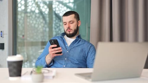 Professional Scrolling Mobile Phone At Desk