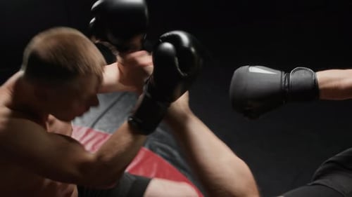 Fighters Practicing Explosive Kick Exchange in Combat Training