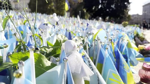 Many Small Flags of Ukraine with Names of the Dead War Against Russia Memorial of the Fallen