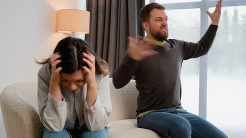 Couple Arguing in Home Living Room
