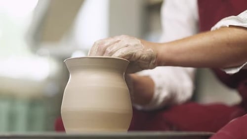 Clay Tableware Production the Potter Makes a Pitcher Out of Clay Closeup View of the Hands