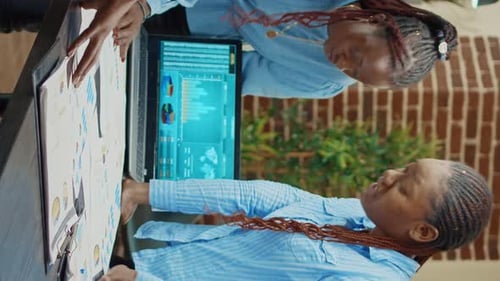 Business Professionals Analyzing Data at a Table