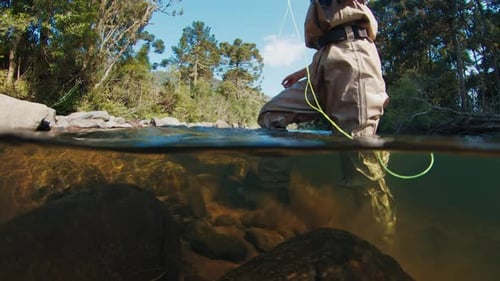 Angler in the River Underwater View