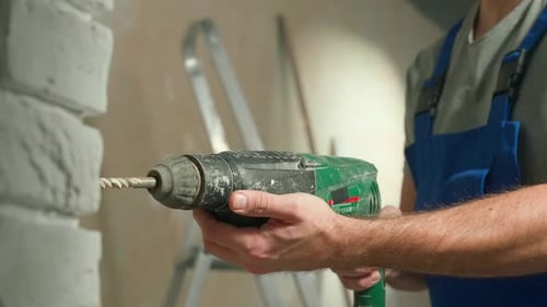 Man Using Drill in Home Improvement Project