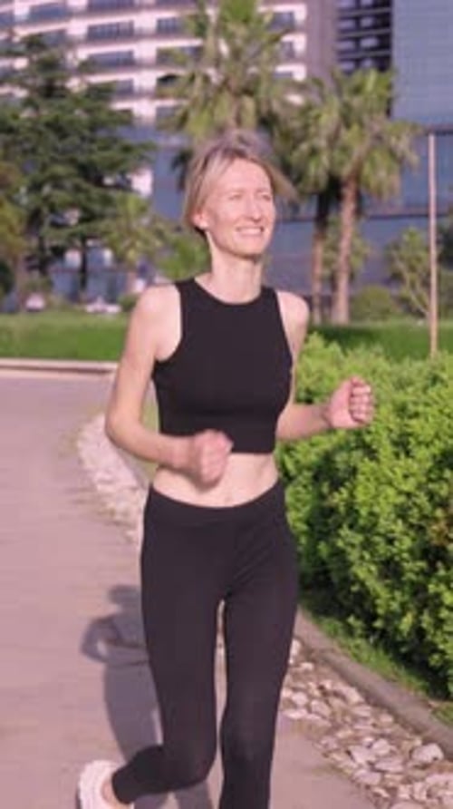 Woman jogging road summer park sports caucasian female morning exercise