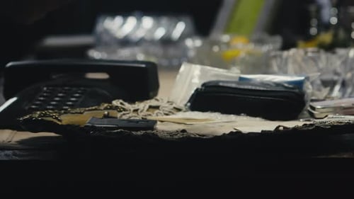 Person placing a pile of old postal mail letters on retro office desk