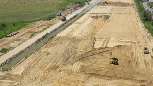 Large view on the road rollers working on the new road construction site. Aerial View