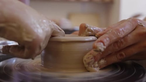 Creating Beautiful Pottery on the Wheel in a Sunny Studio Setting