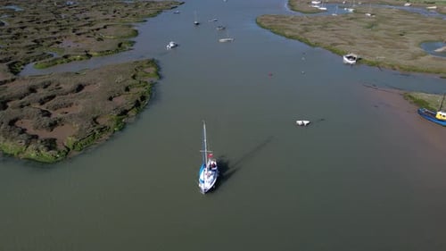 Boats Sailing in River Blackwater near Marshes of Tollesbury, Essex, UK - Aerial