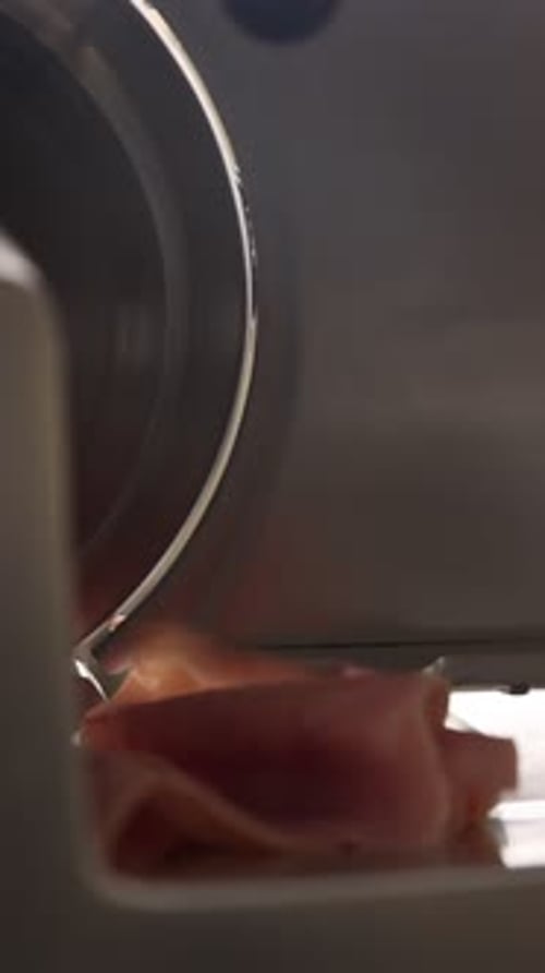 Slicing Ham on Meat Slicer in Vertical Orientation