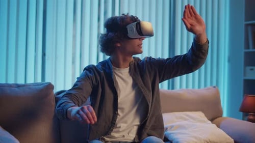 Young Adult Immersed in Virtual Reality Headset Experience