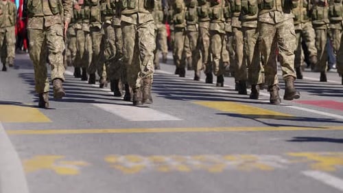 Soldiers Marching in Formation on City Street