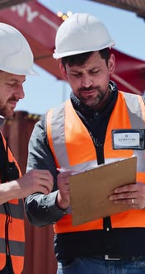 Shipping yard, meeting and men with clipboard for distribution, supply chain and inventory list