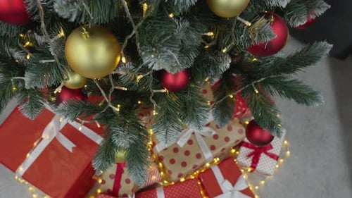 Christmas Tree with Beautifully Wrapped Gifts Beneath