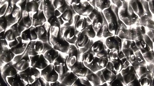 Abstract Rippling Black and White Liquid Pattern